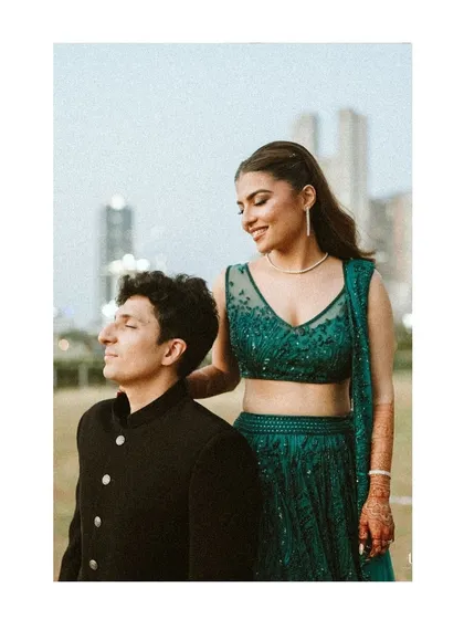 A portrait of Radhika and Shyam against the Mumbai skyline. The soft focus on the background emphasizes the couple, creating a sense of calm intimacy amidst the city's presence.