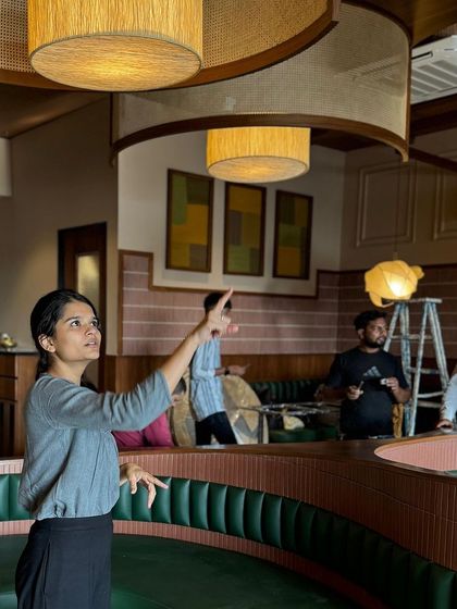 Here, our co-founder Manuni Patel is on-site at the Eat Punjab restaurant, overseeing the installation of the custom lighting. Her attention to detail and hands-on approach ensure that our design vision is executed with precision and care.