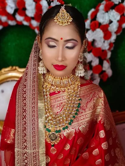 A close-up showing the detailed eye makeup with a soft shimmer, which adds a modern touch to the traditional look.