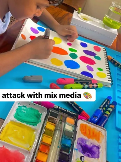 See the magic of process art in action. With my kits, there are no rules, just pure exploration. This little artist is using a mix of watercolors and crayons to create his own world of dots, building confidence and telling his own story with every color he chooses.