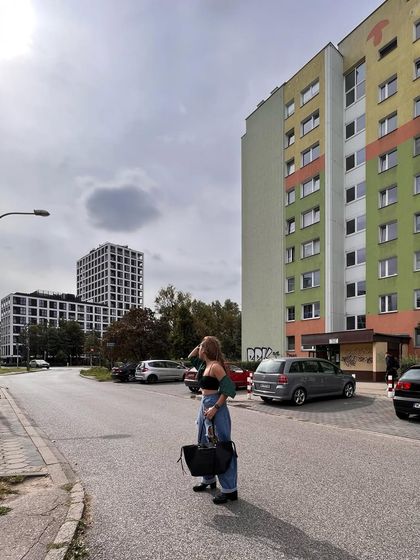 Taking in the sights in Poland. A casual outfit is a must for a day of walking and location scouting.