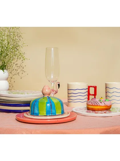 A still life of a colorful, modern tableware set, perfect for a brand's product catalog.