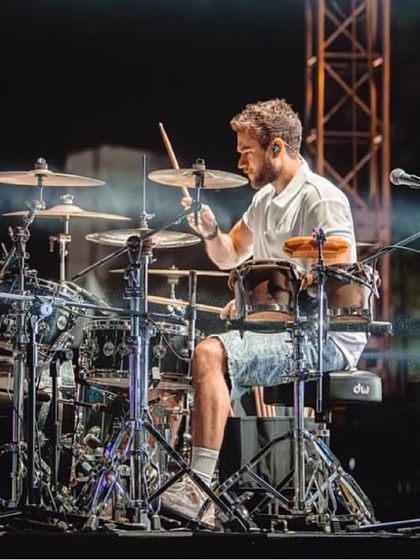 Zedd's live drummer performing during the Telos India Tour, adding a dynamic, live instrumental element to the electronic show.