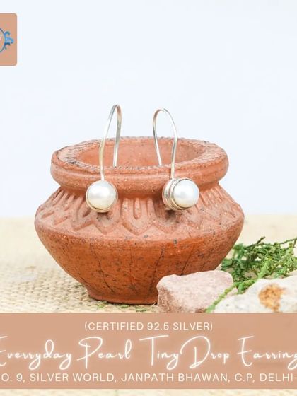 The pearl version of our tiny drop earrings, these are perfect for a classic, understated look. The long hook design is modern and secure.