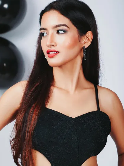 A close-up beauty shot from the party dress series. The red lip and black dress are a classic combination.