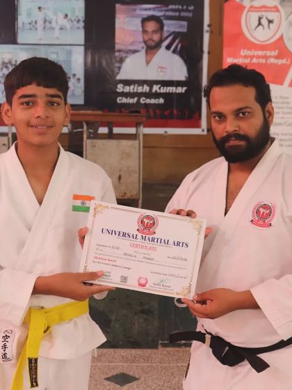 A teenage student receives his yellow belt certificate from our Chief Coach. We have separate groups for different ages, so teenagers and adults train with their peers.