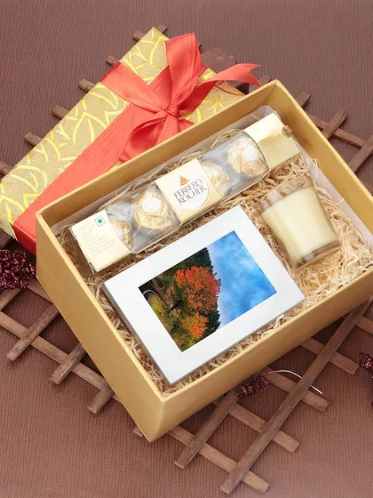 Another example of our festive gift photography, this image showcases a hamper with chocolates and a photo frame. We use careful styling and lighting to create an inviting and high-quality presentation.