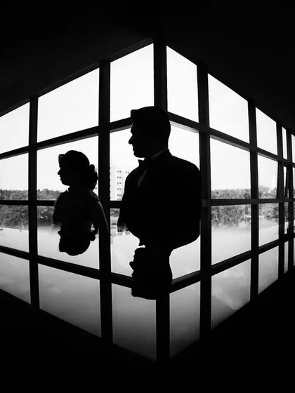 We love playing with light and shadow to create something truly artistic. This dramatic silhouette shot is a testament to finding beauty in simplicity, turning a simple portrait into a timeless piece of art.