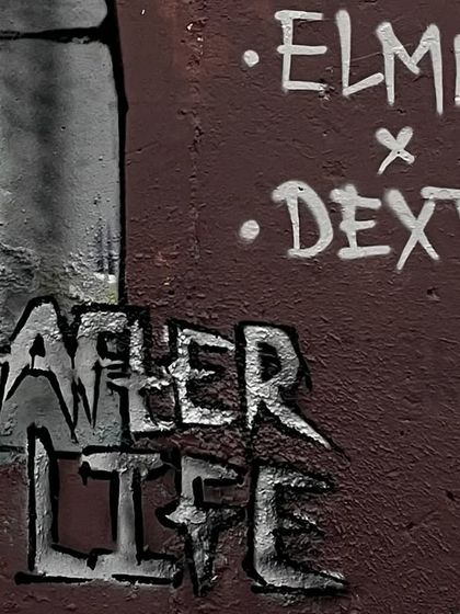 The artist tags on the "AFTER LIFE" mural. Collaboration is a huge part of graffiti culture, and we always sign our work together on a finished wall.
