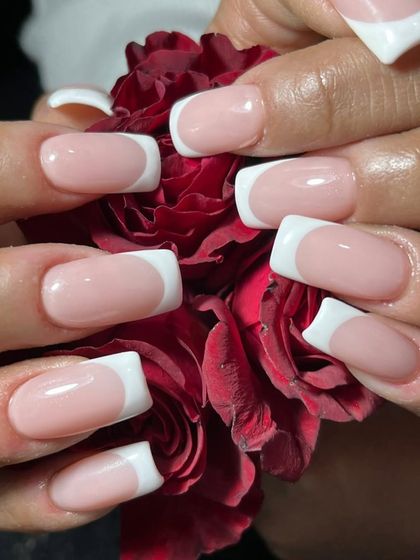 You can never go wrong with a classic French manicure. This close-up shows our perfectly executed, crisp white tips on a squared nail shape. It’s a clean, timeless, and elegant look that is perfect for any occasion.