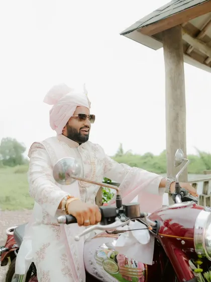 The Baraat is pure energy. The groom's grand entrance on a Bullet, surrounded by his crew, is the kind of stylish, high-energy moment that kicks off the celebration.