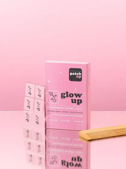 Pink on pink with a touch of reflection. This shot uses a mirrored surface to create a sleek, elegant feel for these 'glow up' patches, while the comb prop adds a relevant, real world context.