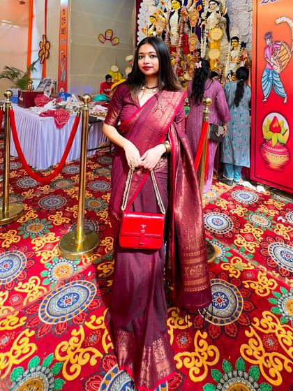 Another angle of my puja outfit, showing how the rich fabric of the Benarasi saree catches the light. This is a perfect example of a timeless piece for any festive occasion.