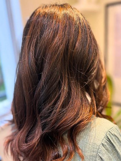 A closer look at the rich tones in our Cinnamon Balayage, showing how the colour catches the light through soft waves.