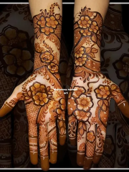 A classic floral mehendi with a mix of different flower sizes and styles. The design covers the hands completely, offering a rich and textured look perfect for a bride.