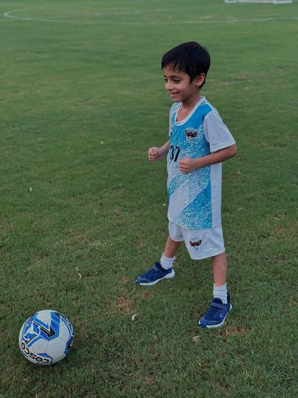 A future star in the making. A young player enjoys his time on the pitch, developing a love for the game.