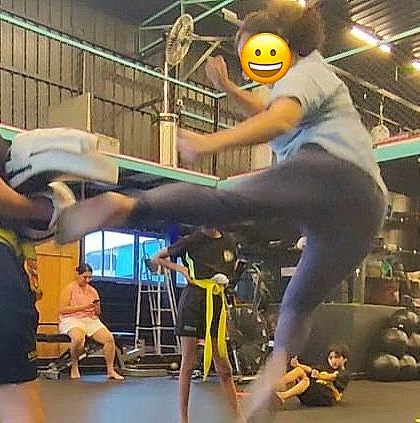 A dynamic shot of a student practicing a flying side kick. We love teaching techniques that challenge our students and show them what they're capable of.