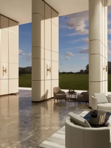 The curved sofas in this lobby seating area soften the modern architecture and encourage conversation. Large windows offer expansive views, connecting the indoor space with the outdoors.