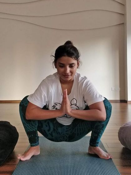 Finding stillness and grounding in Malasana (Garland Pose), a fundamental squat that opens the hips and lengthens the spine.