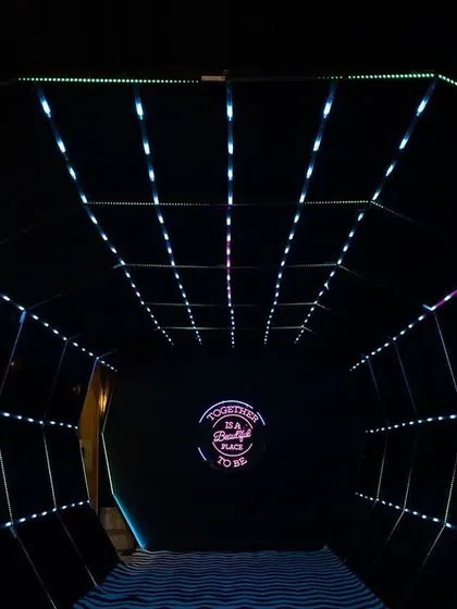 The entrance to the Sangeet was a futuristic tunnel of light, creating an exciting and dramatic transition into the main event space.