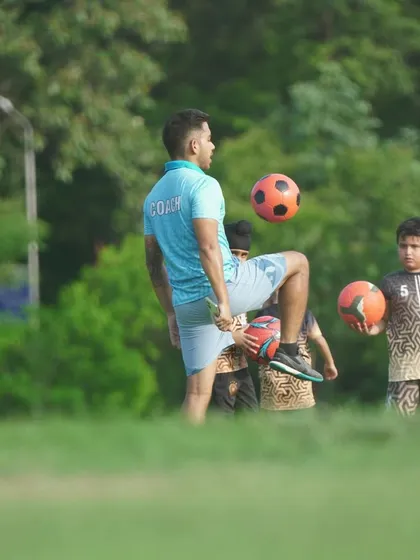 A coach showing off his skills to inspire the young players. Leading by example is a key part of our philosophy.