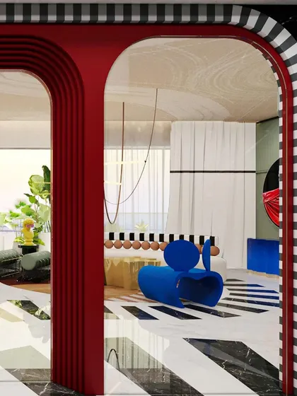 Another view through the red archway, showcasing the layered and dynamic composition of the living and dining spaces.