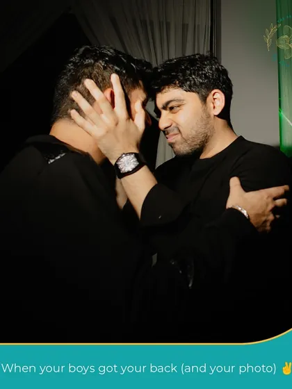 "When your boys got your back (and your photo)." A moment of true friendship and support amidst the wedding festivities.