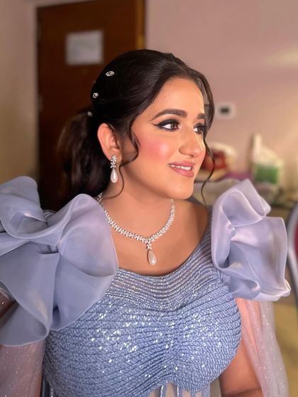 A close-up of the pastel glam, highlighting the shimmery eye and the radiant, flawless skin.