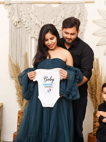 A heartwarming studio family portrait announcing a new arrival, with the big brother-to-be standing proudly. This shows how I include the entire family in the maternity journey.