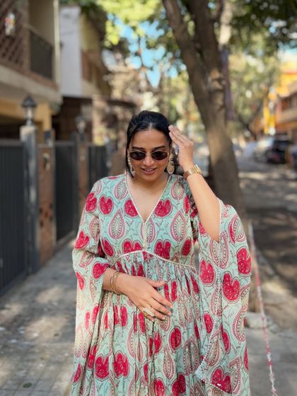A comfortable yet festive block-printed kaftan dress. This is a great choice for hosting a relaxed daytime event like a Mehendi or a poolside party.