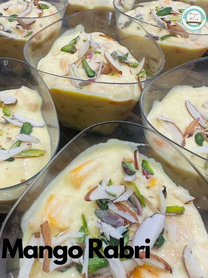 Delight in the exotic sweetness of our Mango Rabri, a traditional Indian dessert infused with the luscious flavor of ripe mangoes and topped with nuts.