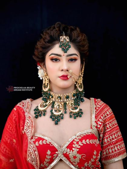 A direct, stunning portrait of the bride. The hair is pulled back neatly to highlight her features, with volume at the crown to create a regal shape.