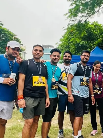 A group of runners wearing their finisher medals after the race. The sense of accomplishment is a huge part of the experience.