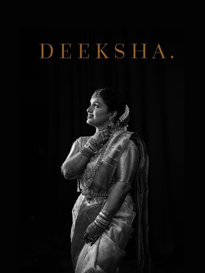 A stunning black and white portrait of the bride, Deeksha, exuding elegance and grace.