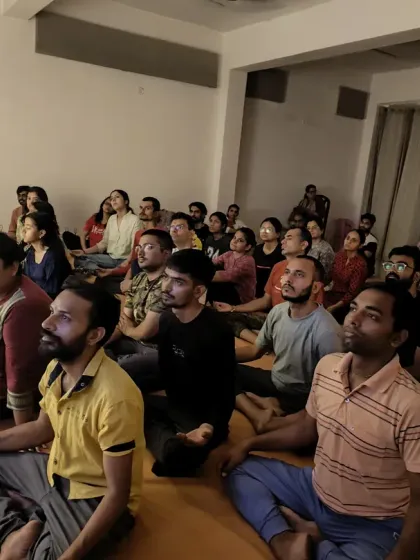 The community meditating together. The collective stillness creates a powerful atmosphere that supports each individual's practice.