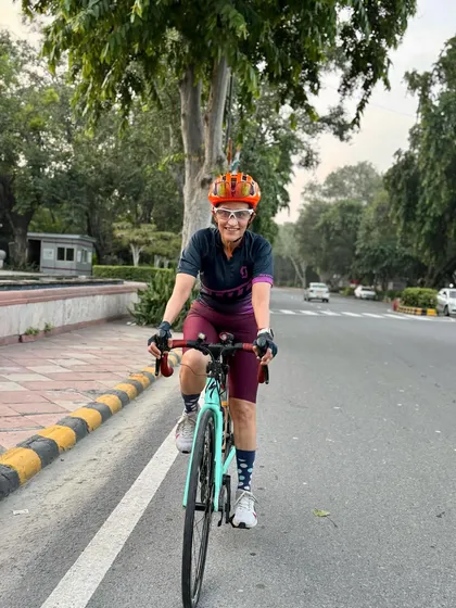 Riding with a smile. The happiness of cycling is evident on her face.