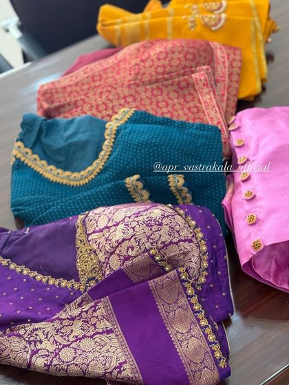 A collection of blouses in various colors and embroidery styles.