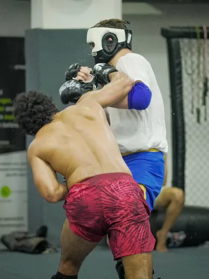 An intense exchange during a competition team sparring session. This is where strategies are tested and fighters are forged in the fire.