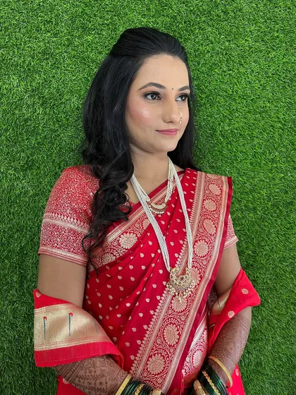 A profile shot showing the soft curls and half-up hairstyle, a popular choice for engagements.