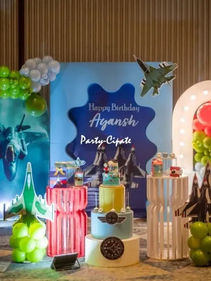 Creating an action-packed fighter jet theme was such a thrill. The setup included a dynamic backdrop showing jets in the sky, balloon clouds, and custom props like a light-up number '8' and model airplanes to make the birthday boy feel like a top pilot.