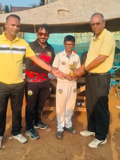 Parth Rane receiving his 'Man of the Match' award for an all-round performance of 44 runs and 2 wickets in the Mumbai Champions Trophy.