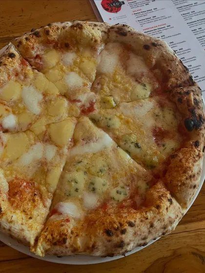 A half-and-half pizza for the ultimate cheese lover. One side Quattro Formaggi, the other something just as cheesy.