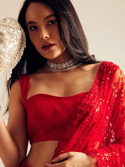 A bold and glamorous look for a commercial shoot. I created a classic red lip and soft, loose hair to complement the vibrant red saree and diamond jewelry.