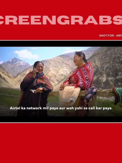 Two women in the village share a happy moment over a phone call, a powerful visual from the Airtel brand film. This shot encapsulates the campaign's core message of connection.