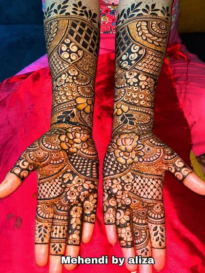 A full-hand floral design with a mix of bold and fine lines, creating a beautiful texture.
