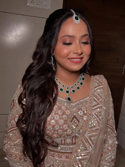 A serene shot with eyes closed, highlighting the subtle and shimmery eyeshadow.