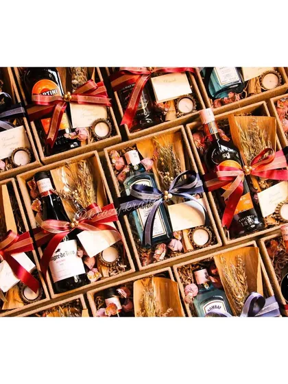 A snapshot of the many custom Diwali hampers I created. Each box was filled with a miniature bottle of wine or spirits, a candle, and other festive treats.