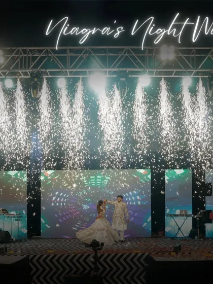 This is what a Sangeet masterpiece looks like. We designed and executed this spectacular stage, complete with a waterfall of pyrotechnics, to create a night of pure cinematic magic for the couple's first dance.