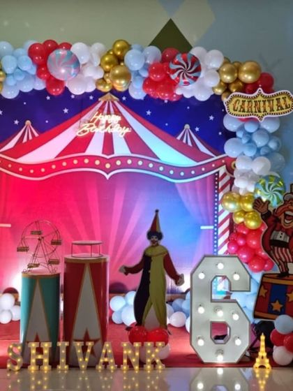 A closer look at the carnival party stage, highlighting the colorful lighting and props.