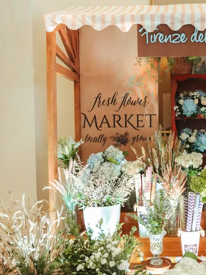 A charming "Fresh Flower Market" station where guests could create their own bouquets, adding an interactive and memorable element to the celebration.